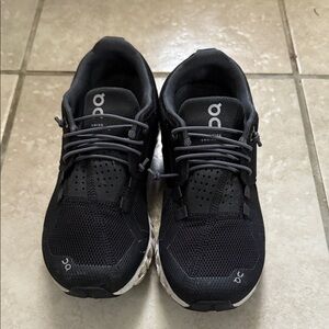 On Running Black Athletic Shoes with White Soles